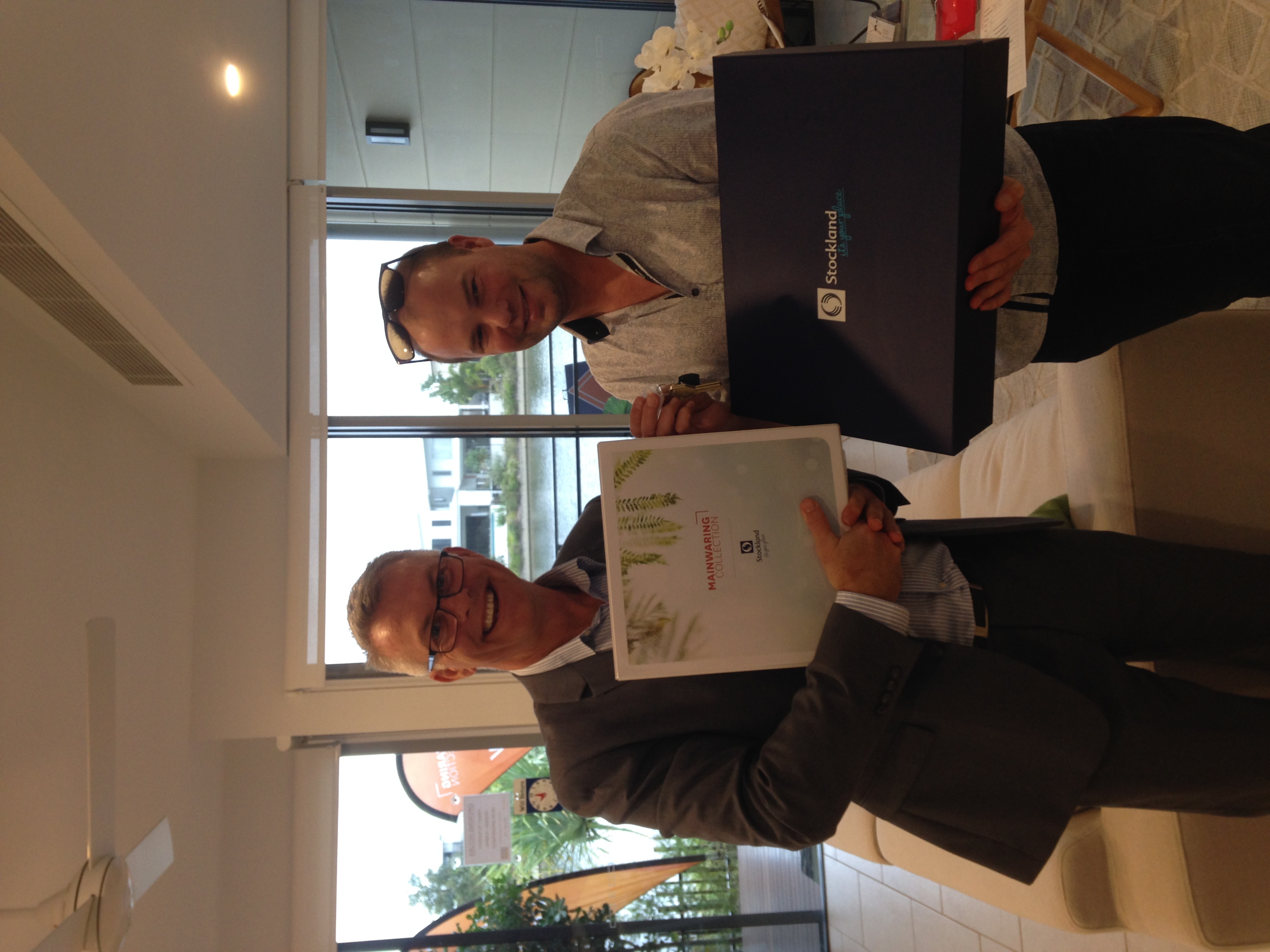 Happy client receiving the keys to their new build